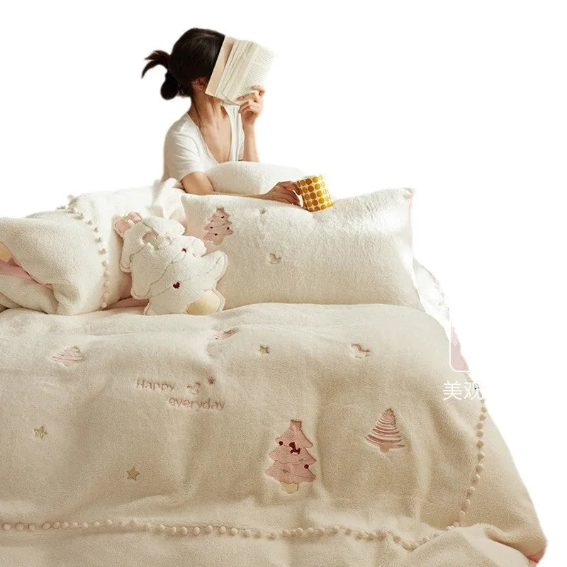 Princess style milk fibre bedding set with green Christmas tree print on a bed, showing quilt cover and pillowcases.
