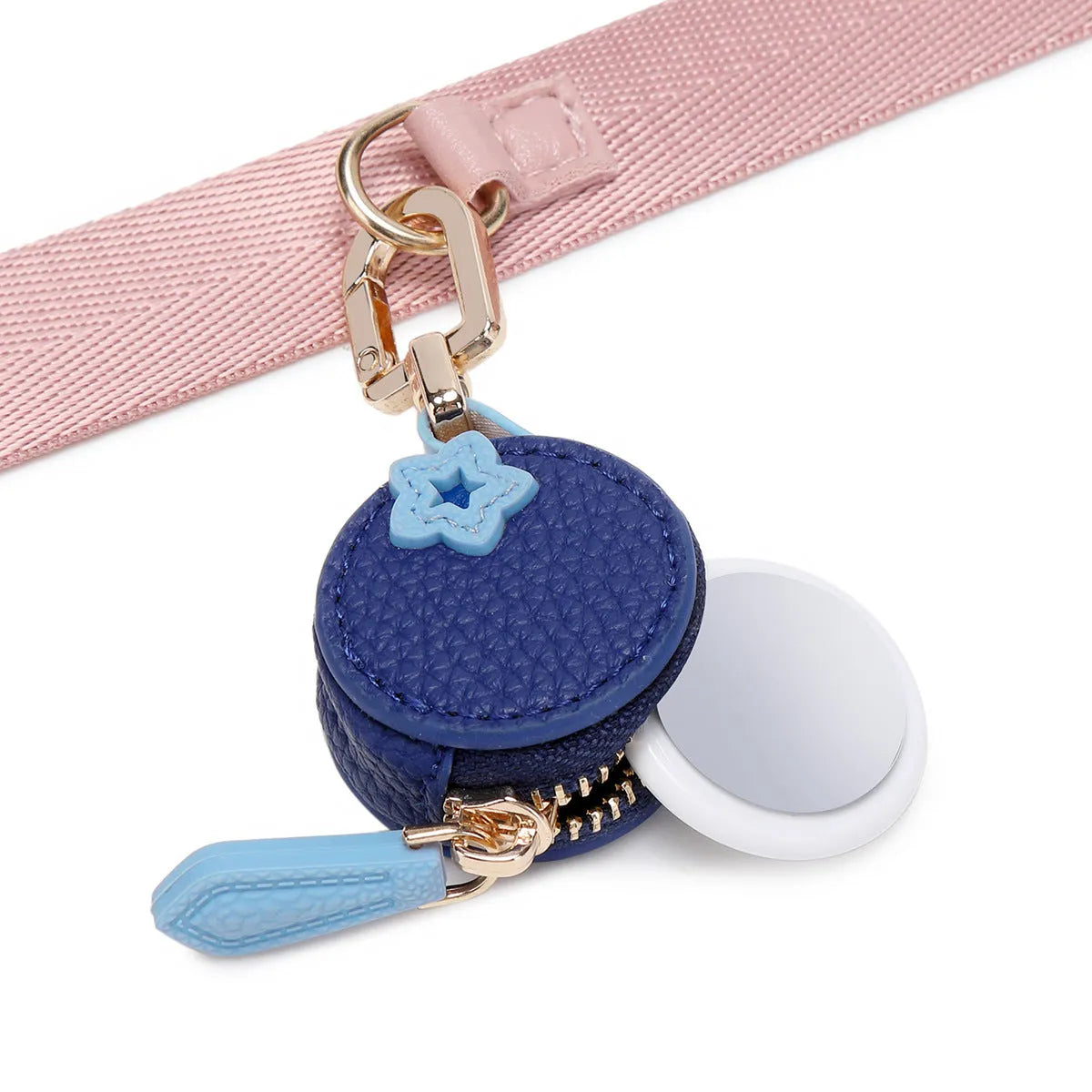 Mini solid colour PU leather coin purse keychain in cherry red, blueberry blue, or orange.