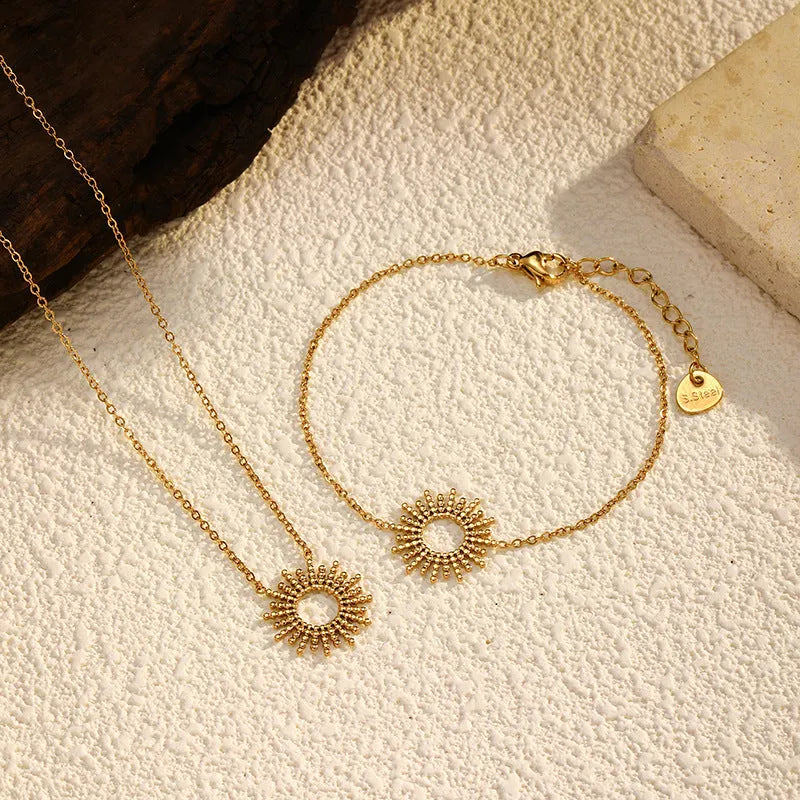 Gold sunflower geometric jewellery set with necklace and bracelet on stainless steel
