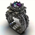 Geometric flower design ring with zircon ornaments in electroplated alloy, showing colour options.