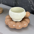 Ceramic coffee set with cup and dish in solid colour options showing simple Nordic design