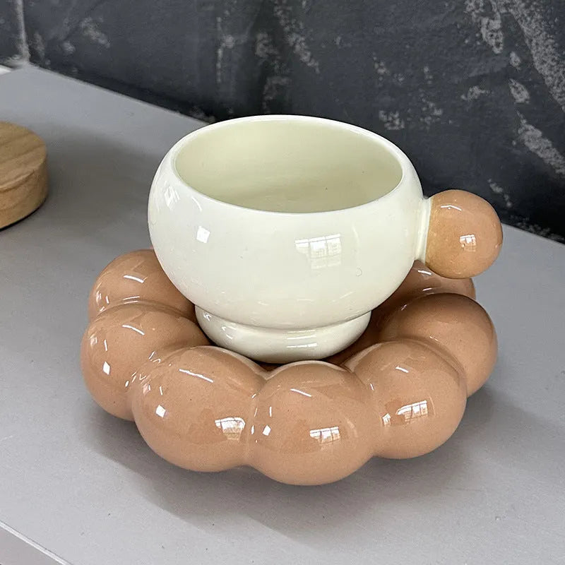 Ceramic coffee set with cup and dish in solid colour options showing simple Nordic design