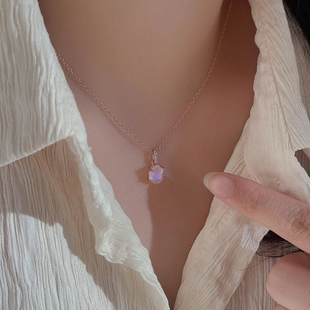 S925 sterling silver moonstone pendant necklace with geometric design on a curb chain.