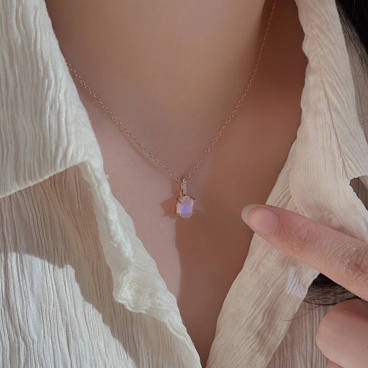 S925 sterling silver moonstone pendant necklace with geometric design on a curb chain.