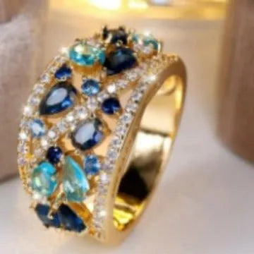 Women's hollow round copper fashion ring shown in gold and platinum with white diamond or blue sapphire accents.