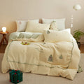 Princess style milk fibre bedding set with green Christmas tree print on a bed, showing quilt cover and pillowcases.