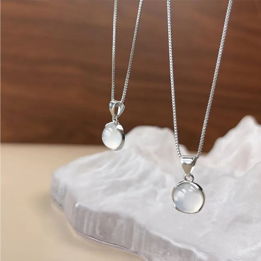 Korean-style oval artificial crystal pendant necklace on an adjustable box chain.
