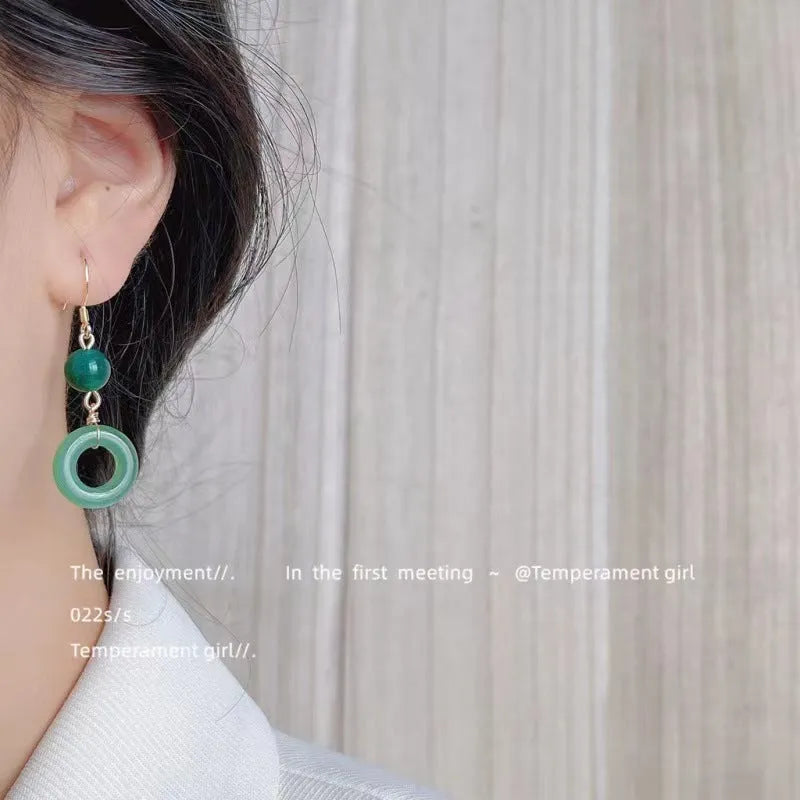 Green jade design peace buckle earrings in 14K gold colour zinc alloy