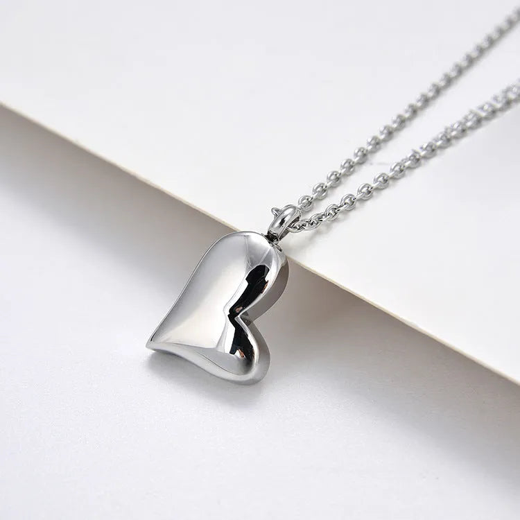 Silver stainless steel curved peach heart pendant necklace with adjustable chain length
