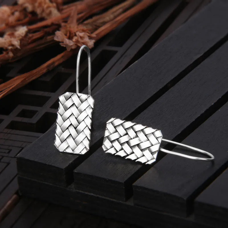 Silver geometric woven diamond plaid earrings measuring 17.5mm by 11mm