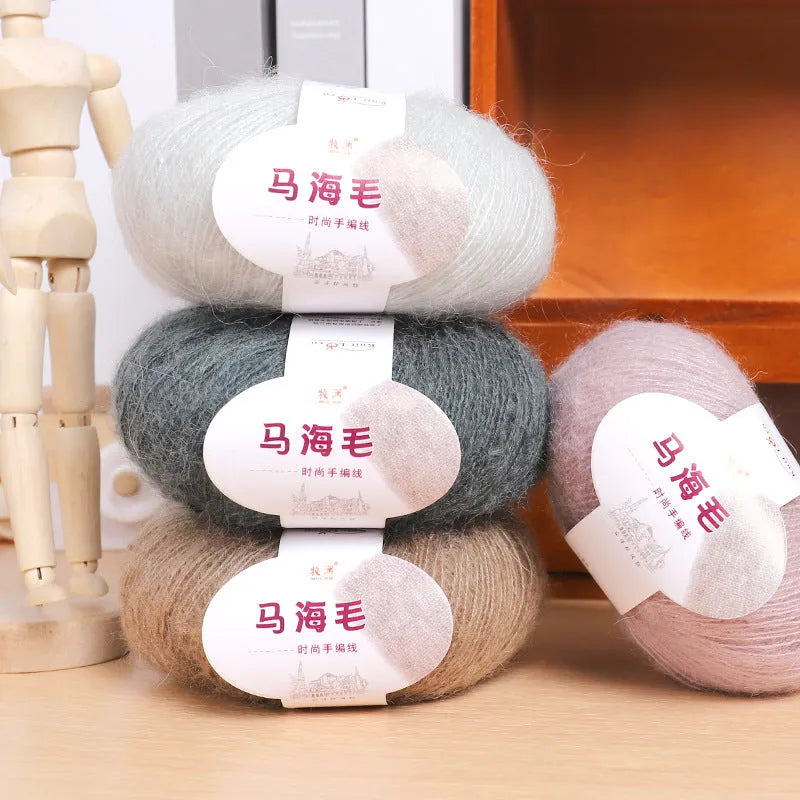A ball of hand-woven mohair wool yarn for a DIY scarf knitting kit in one of 34 available colours.