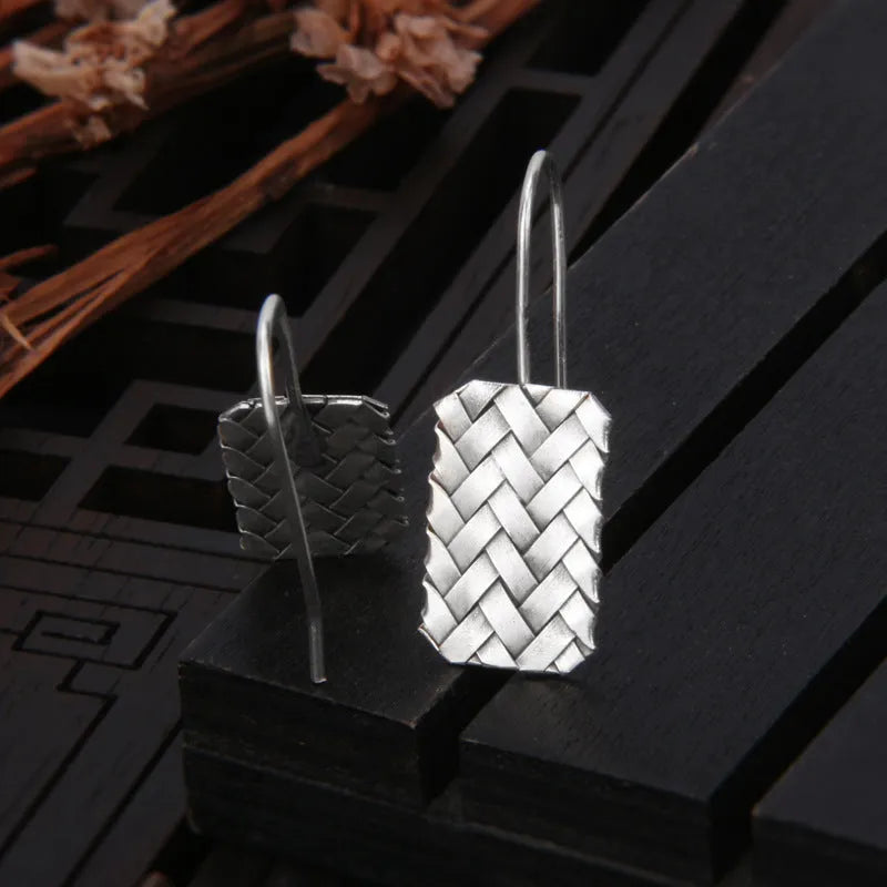 Silver geometric woven diamond plaid earrings measuring 17.5mm by 11mm