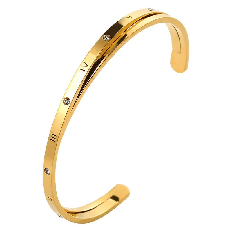 Open-ended stainless steel bracelet with inlaid zircon crystals in a choice of rose gold, gold, or steel colour finish.