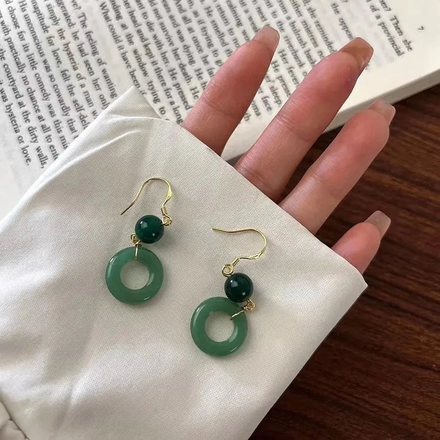 Green jade design peace buckle earrings in 14K gold colour zinc alloy