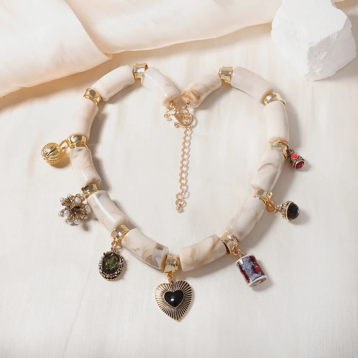 Bamboo resin heart-shaped pendant necklace with electroplated metallic finish on adjustable chain