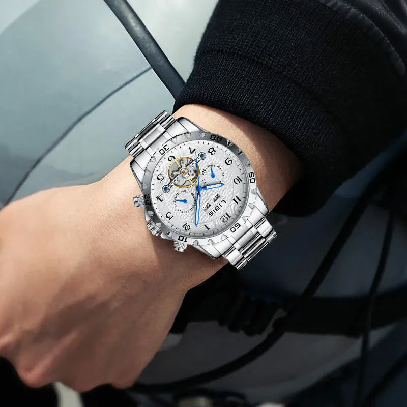 Men's silver stainless steel automatic perpetual calendar watch with sapphire crystal glass.