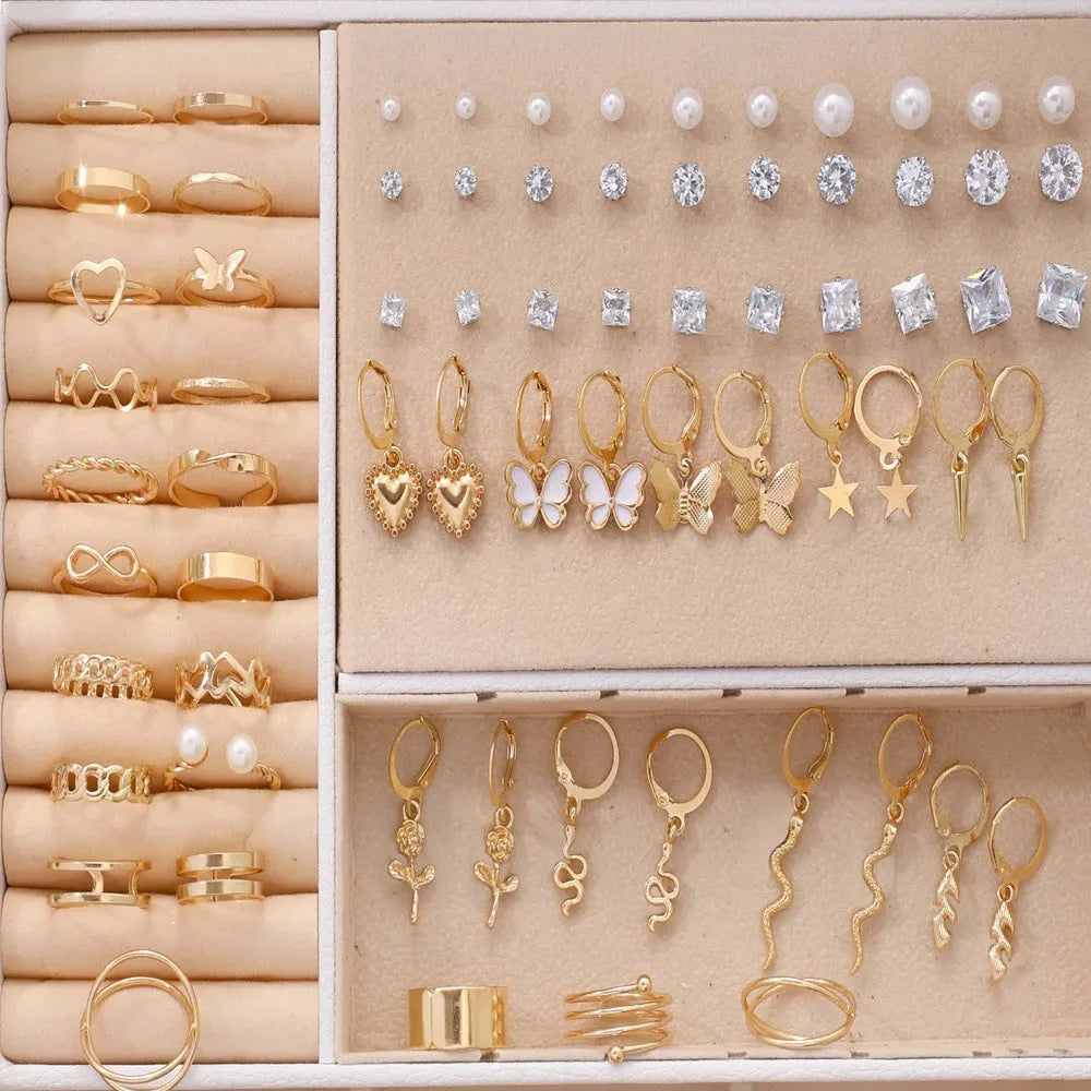 108-piece gold and yellow geometric round pearl earrings multipack on a flat surface.