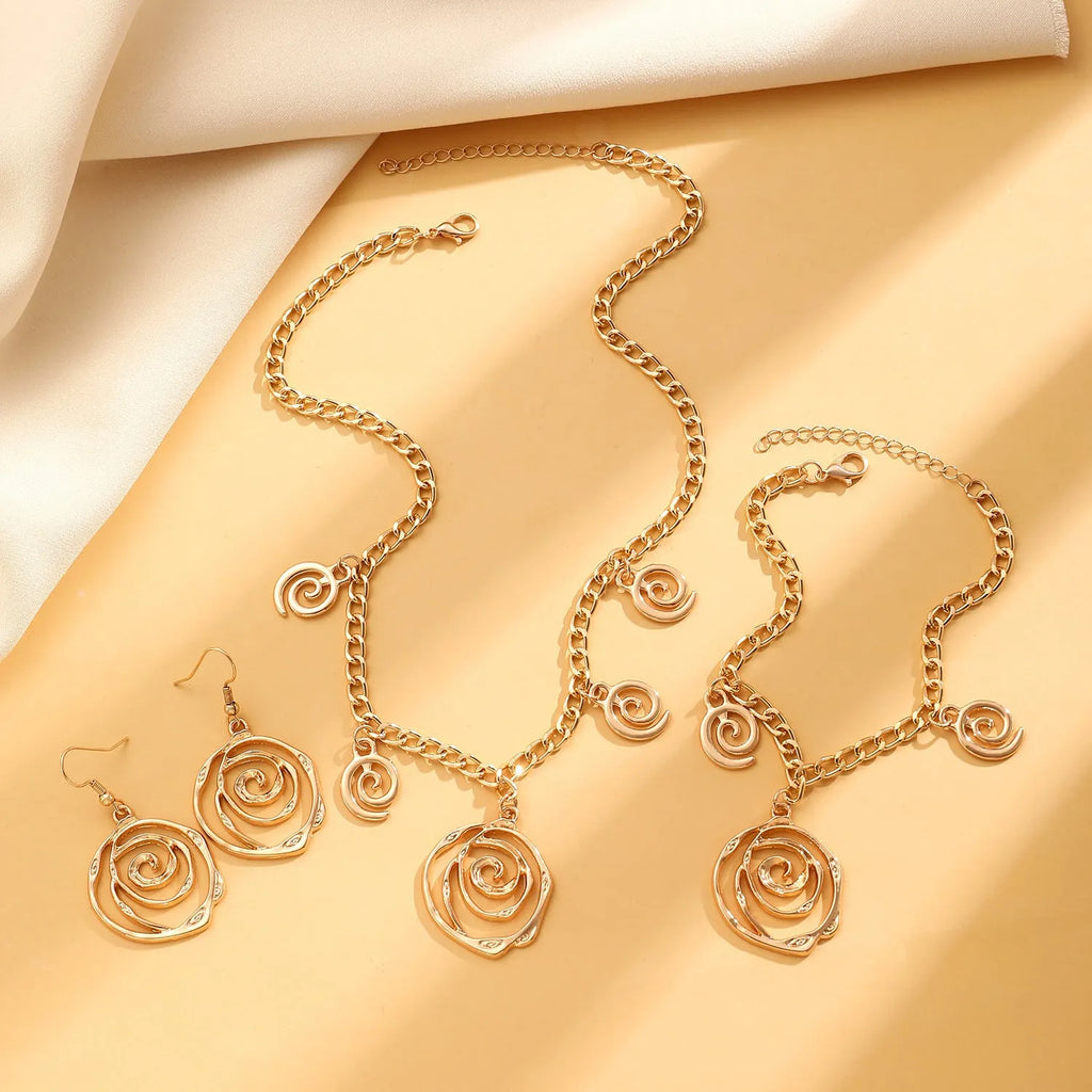 Spiral donut jewellery set showing necklace, bracelet and ear hooks with geometric circle design