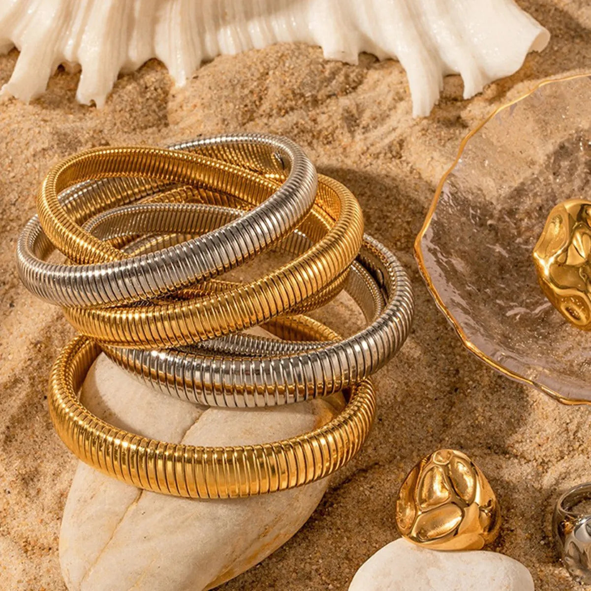 Women's elastic titanium steel bracelet with vertical stripe ring design in gold finish