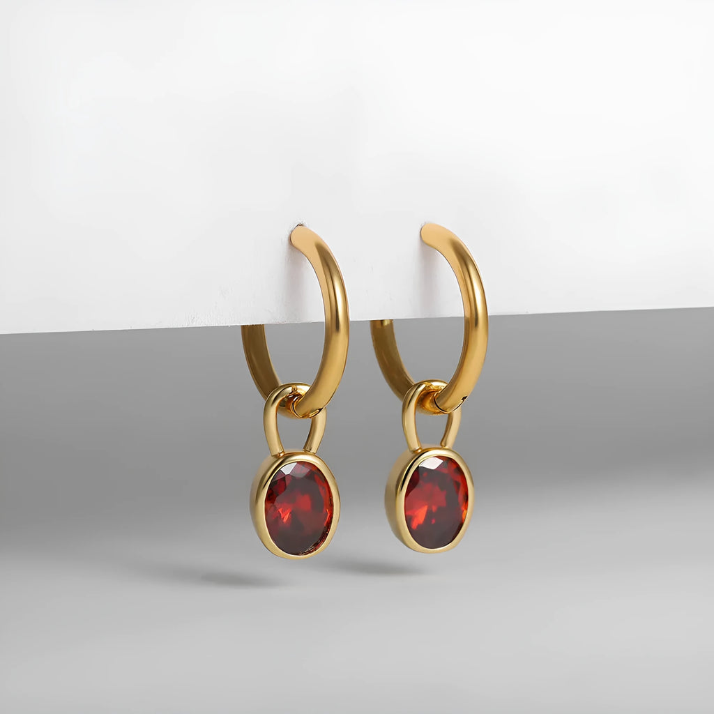 Close-up of women's retro oval zircon earrings in copper, showing the elliptical gemstone setting.