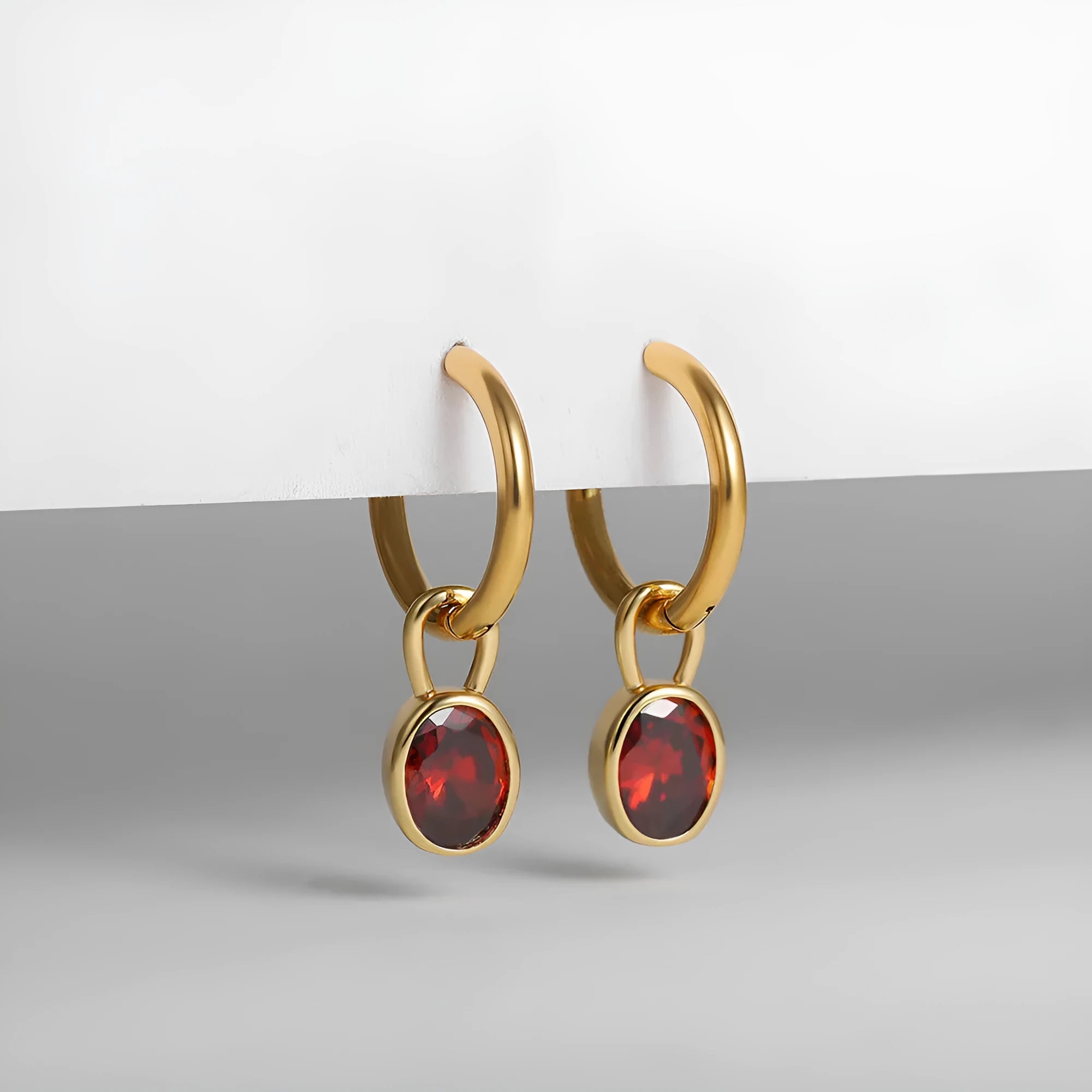 Close-up of women's retro oval zircon earrings in copper, showing the elliptical gemstone setting.