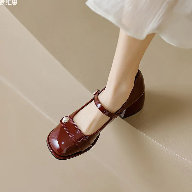 Women's apricot patent leather pumps with chunky heel and square toe, showing buckle ankle strap