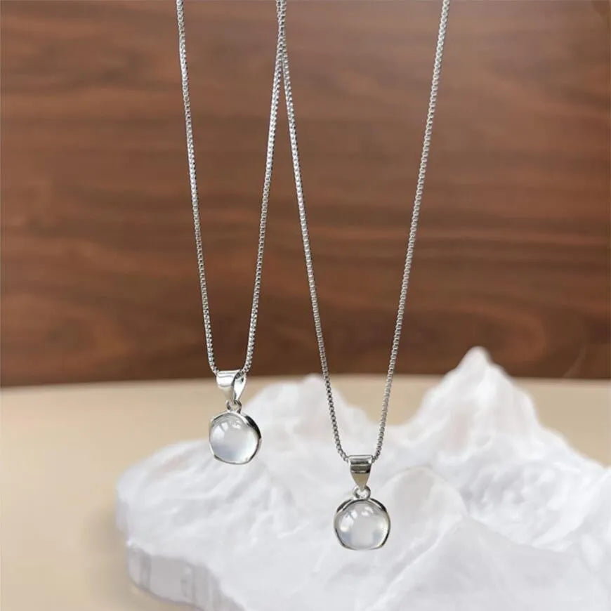 Korean-style oval artificial crystal pendant necklace on an adjustable box chain.