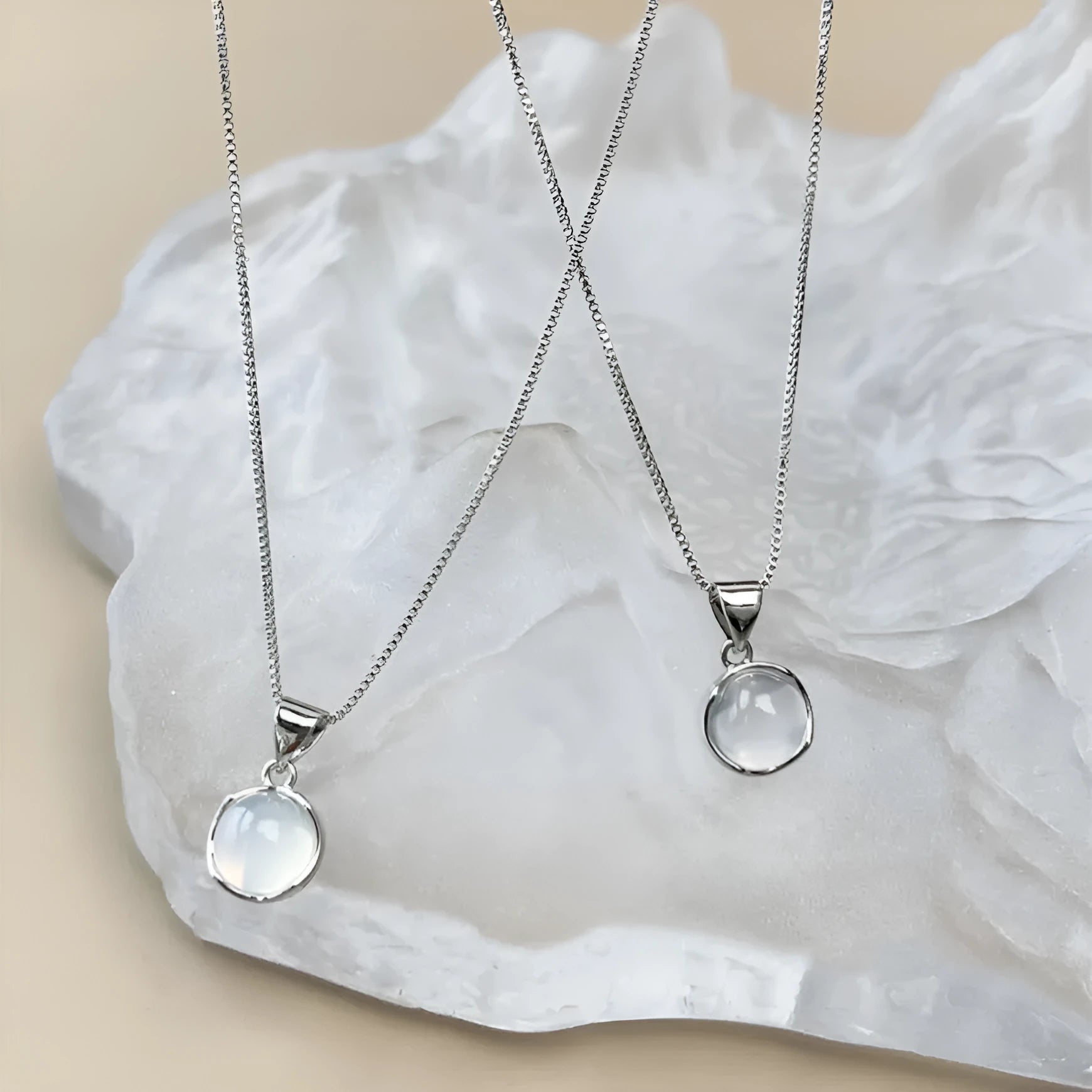 Korean-style oval artificial crystal pendant necklace on an adjustable box chain.
