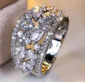 Women's hollow round copper fashion ring shown in gold and platinum with white diamond or blue sapphire accents.