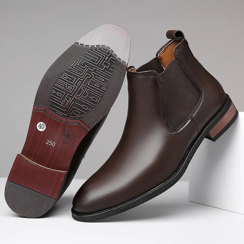 Men's black Chelsea boots with round pointed toe and visible stitching detail