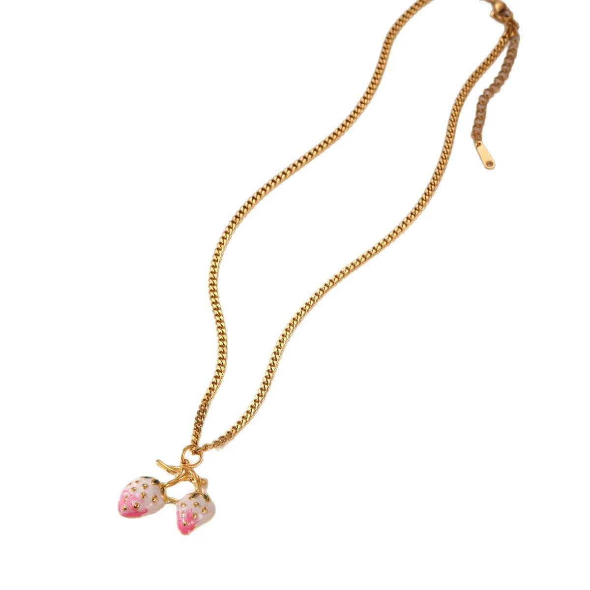 Close-up of a women's strawberry fruit pendant necklace with a detailed alloy charm on a stainless steel chain.