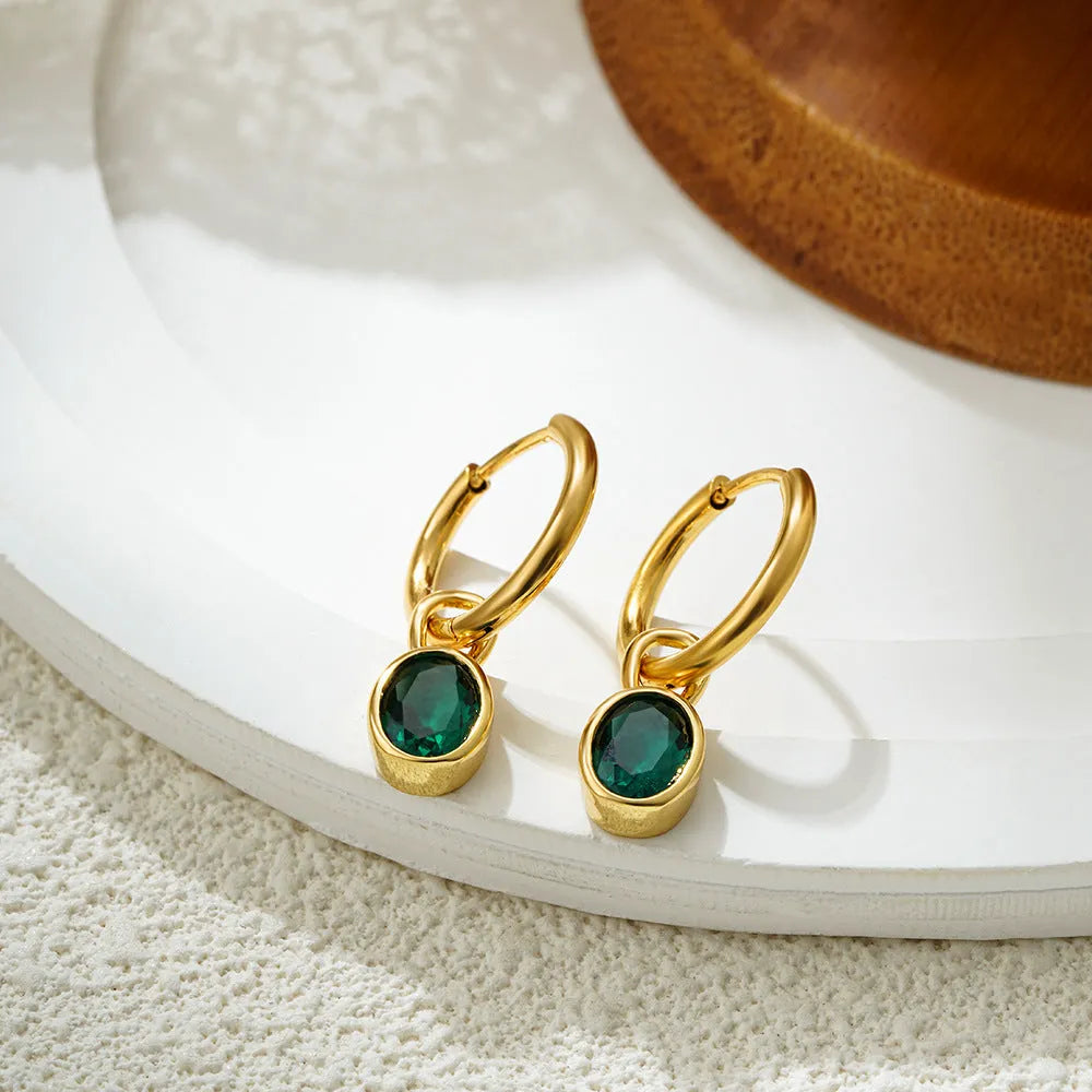 Close-up of women's retro oval zircon earrings in copper, showing the elliptical gemstone setting.