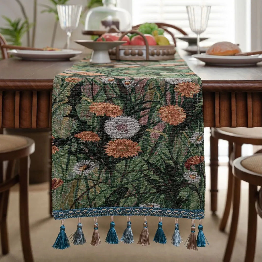 American-style beige jacquard table runner with floral pattern and long tassels on a dining table.