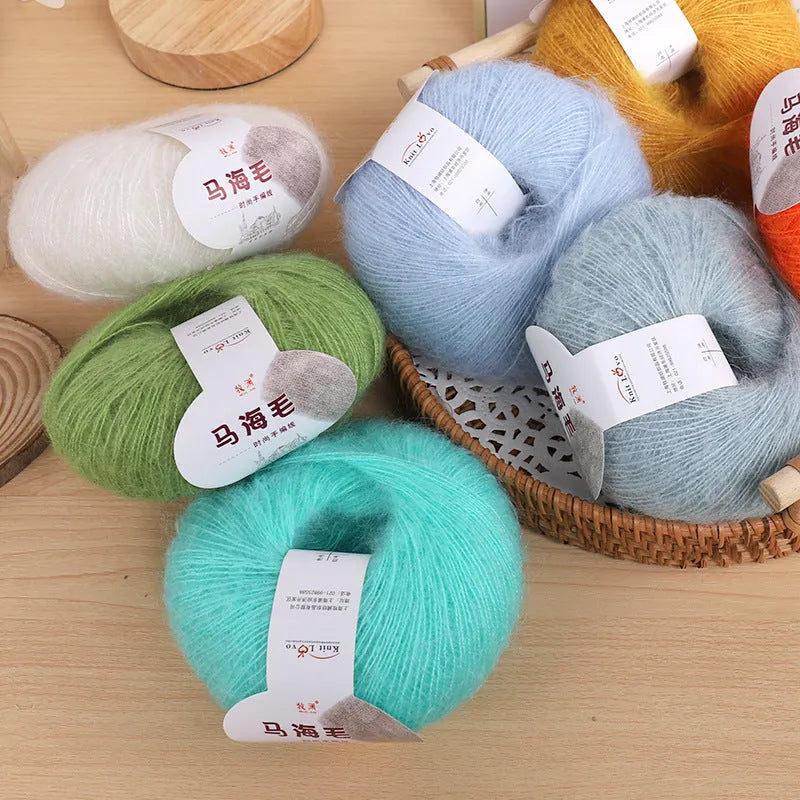 A ball of hand-woven mohair wool yarn for a DIY scarf knitting kit in one of 34 available colours.