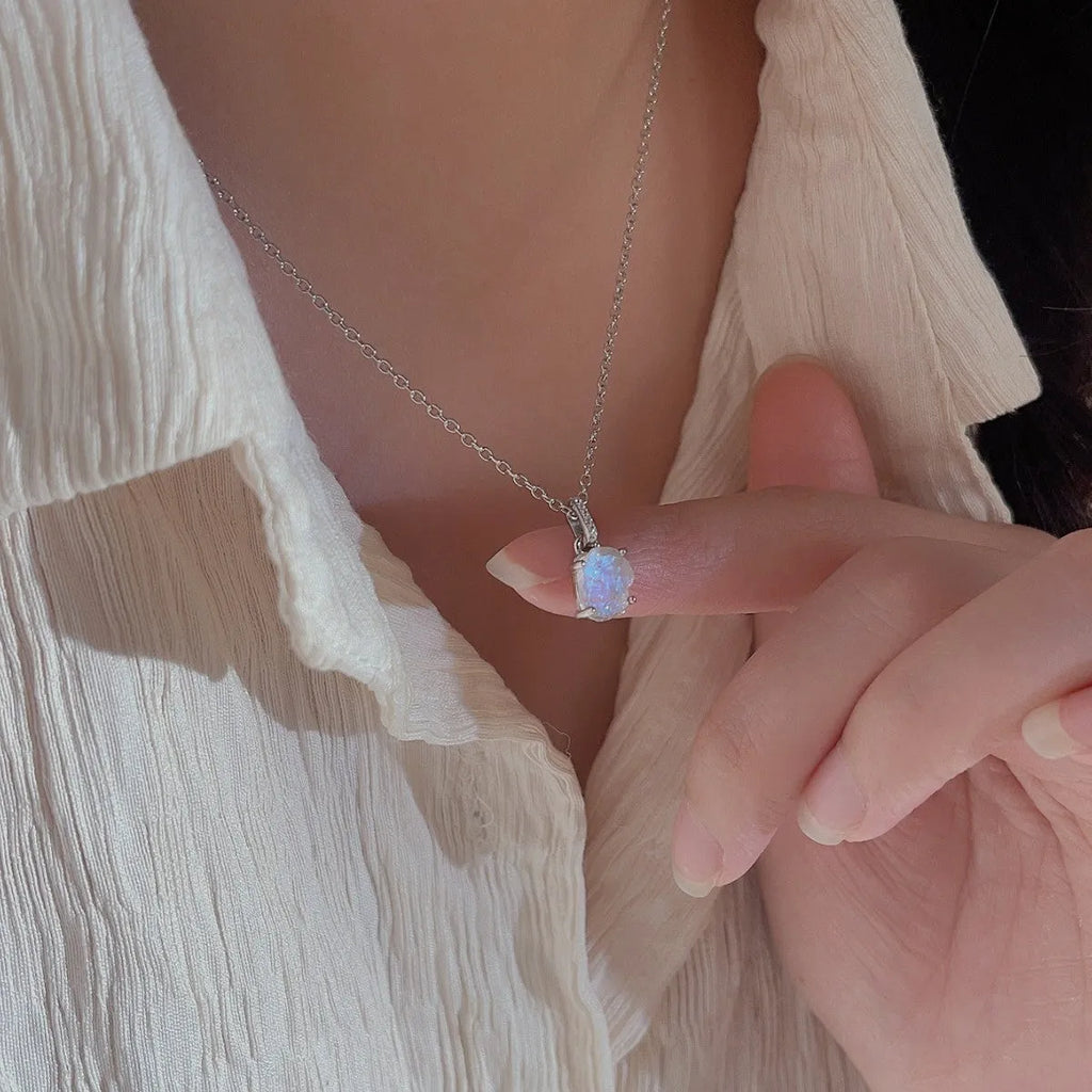 S925 sterling silver moonstone pendant necklace with geometric design on a curb chain.