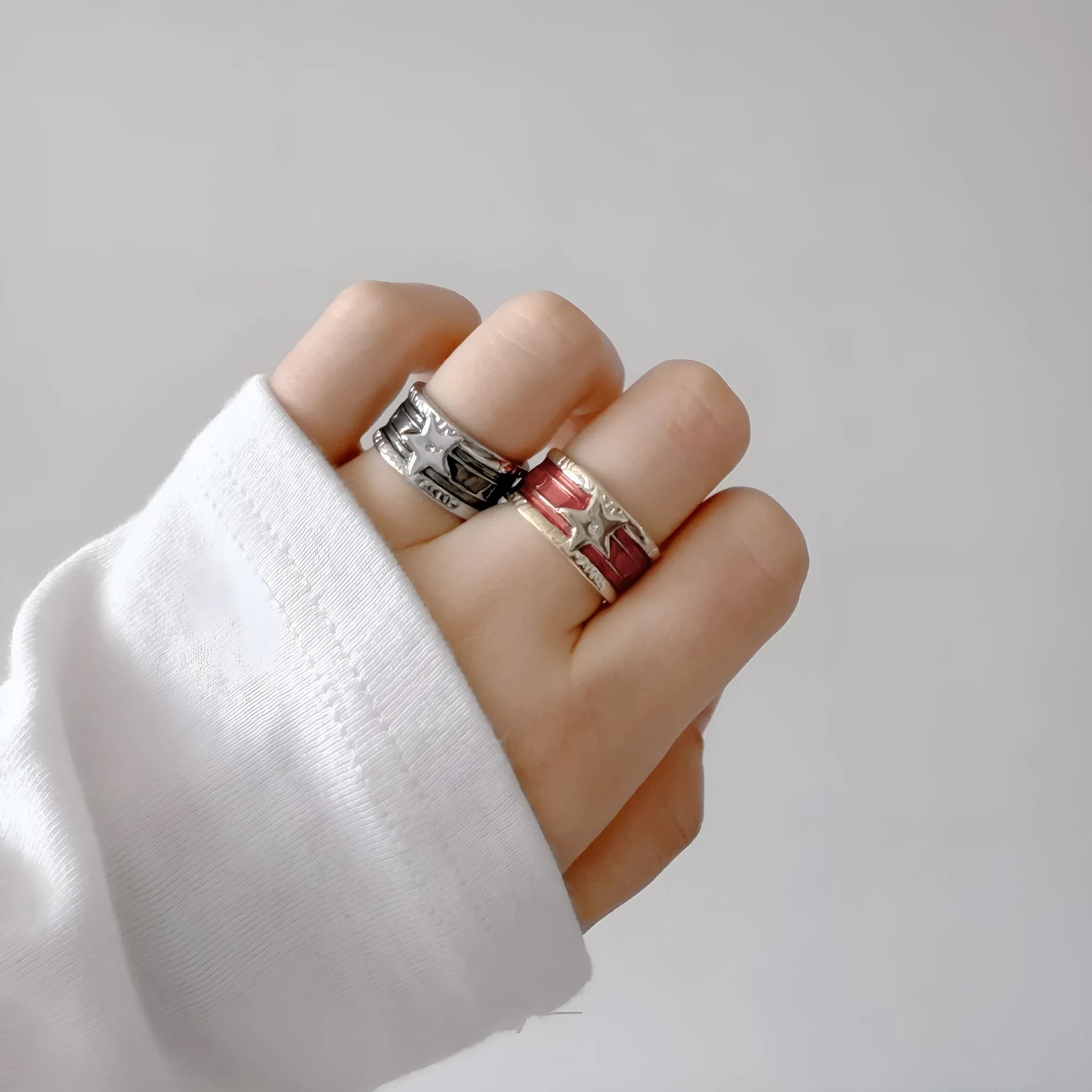 Adjustable geometric oil drop ring in distressed retro finish on copper, showing colour options.