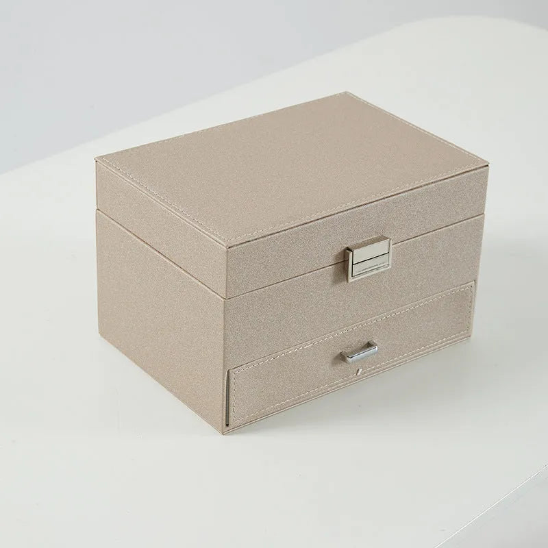 Hard-sided PU leather jewellery box in beige colour, dimensions 22.5x15.5x14cm.
