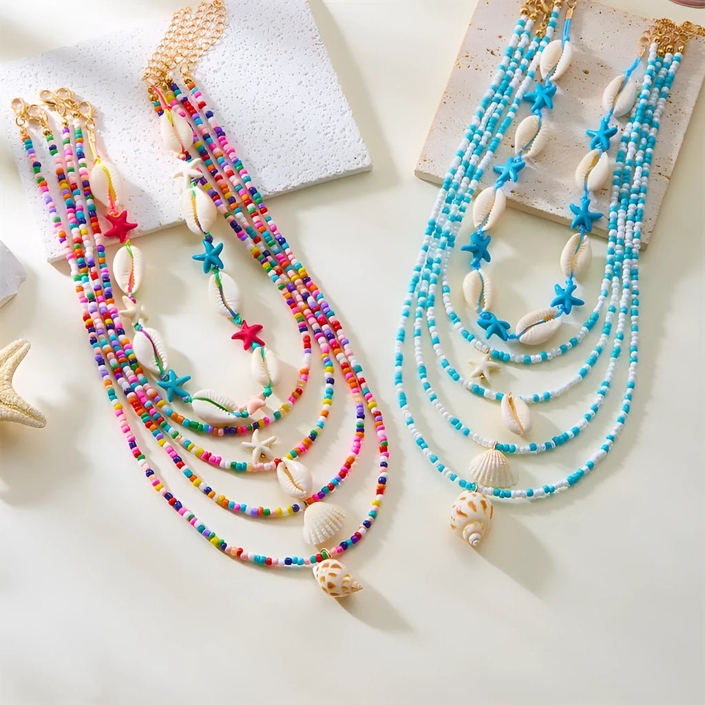 Five women's necklaces with starfish shell conch bead designs in blue and multicolour with alloy pendants