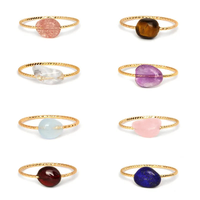 Geometric shaped agate ring for women in a solid colour on a neutral background.