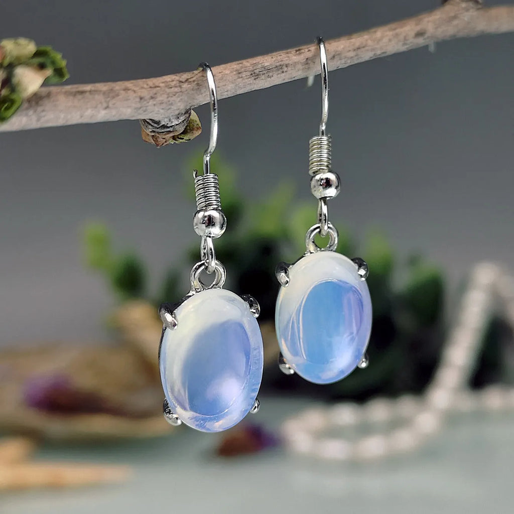Moonlight white opal earrings with retro cross design and drop shape featuring ellipse elements