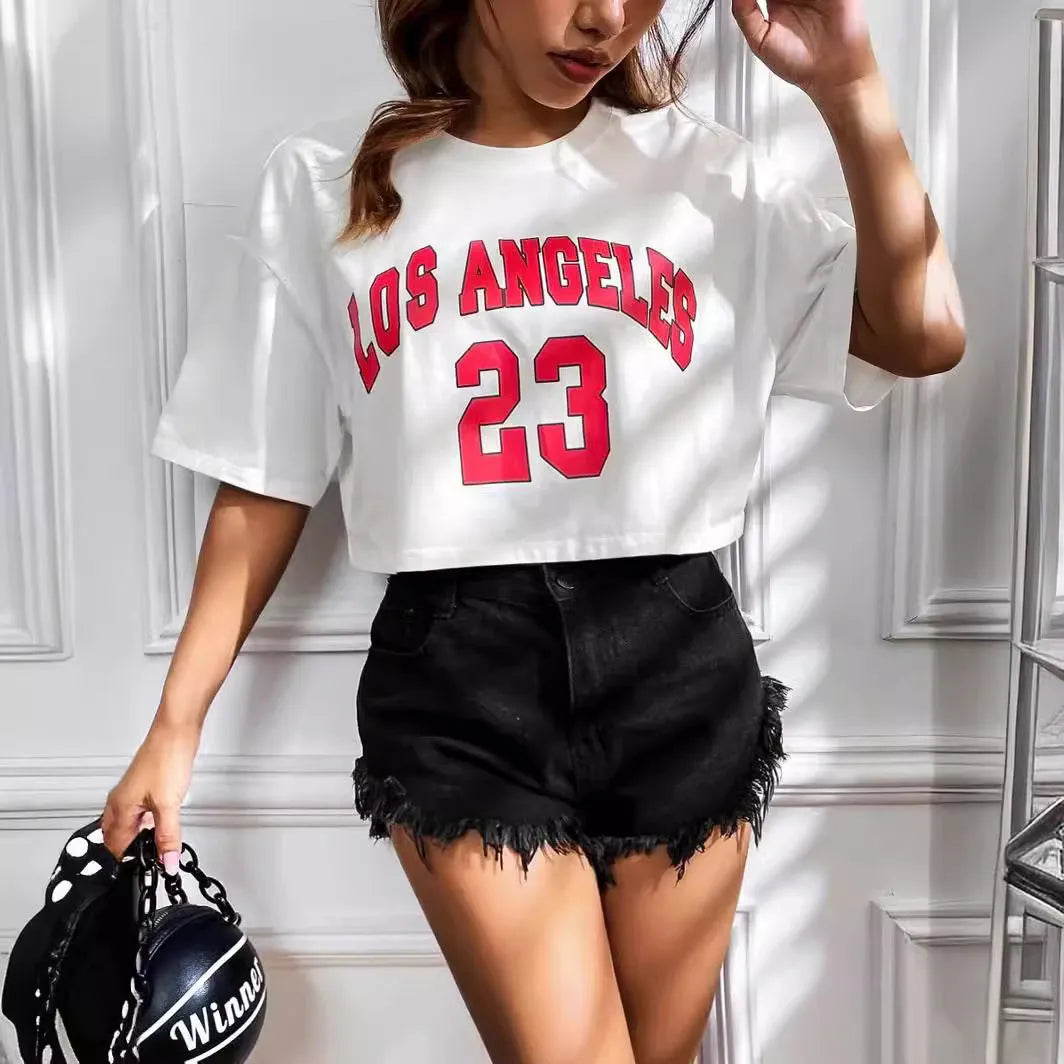 Black loose-fit cotton crop top t-shirt with printed white English letters, short sleeves, and an exposed navel.