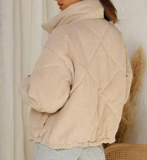 Apricot women's corduroy wadded jacket with a stand collar and front zip.