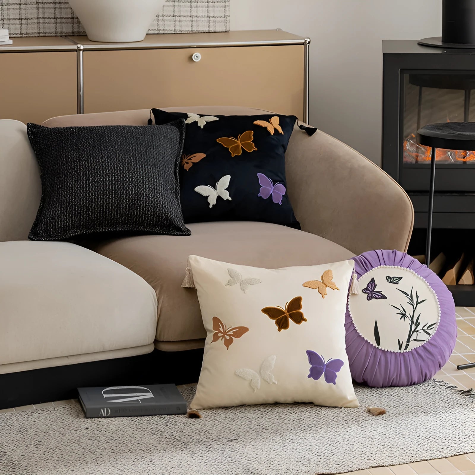 Square beige, black, and purple cushion with embroidered Chinese butterfly pattern.