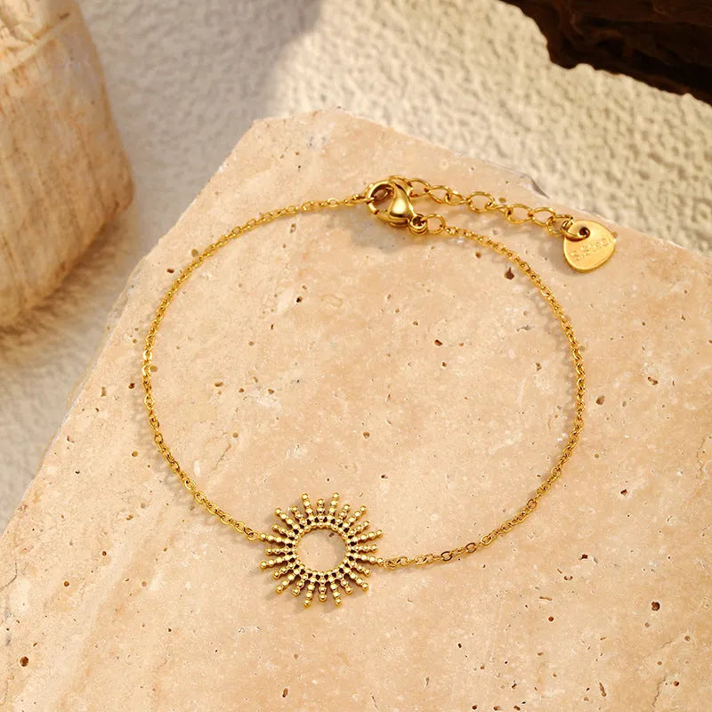 Gold sunflower geometric jewellery set with necklace and bracelet on stainless steel
