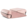 A triangular wedge pillow in a choice of five colours, showing embroidered detail on its surface.