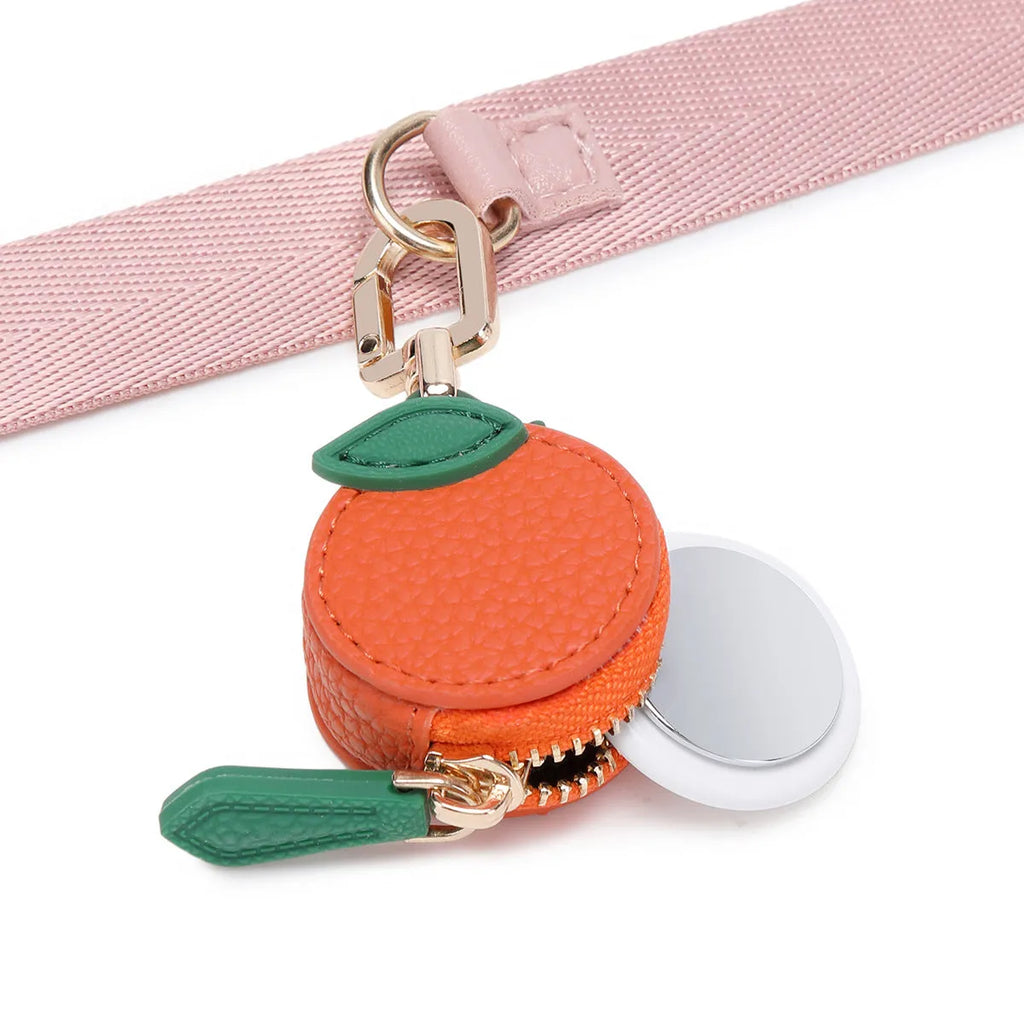 Mini solid colour PU leather coin purse keychain in cherry red, blueberry blue, or orange.