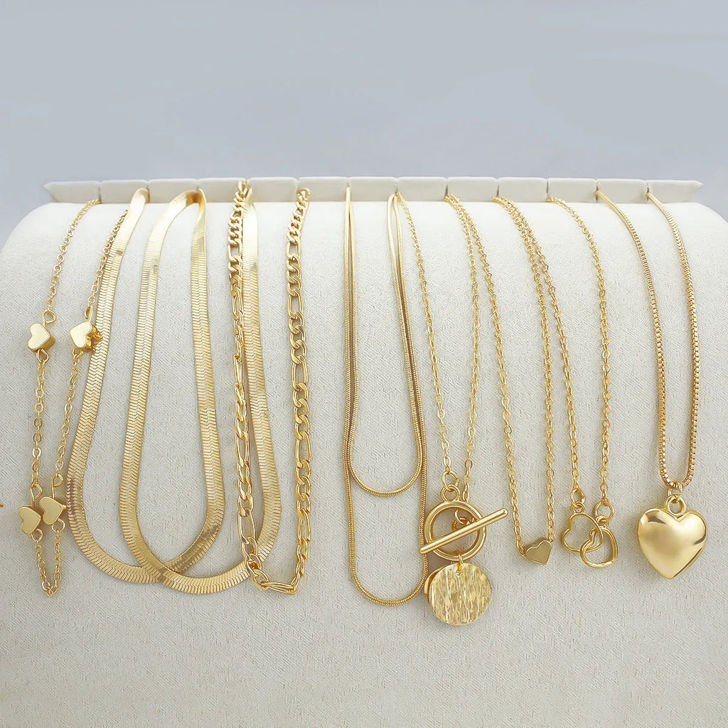 10-piece gold women's necklace set with adjustable snake bone chain and alloy pendants