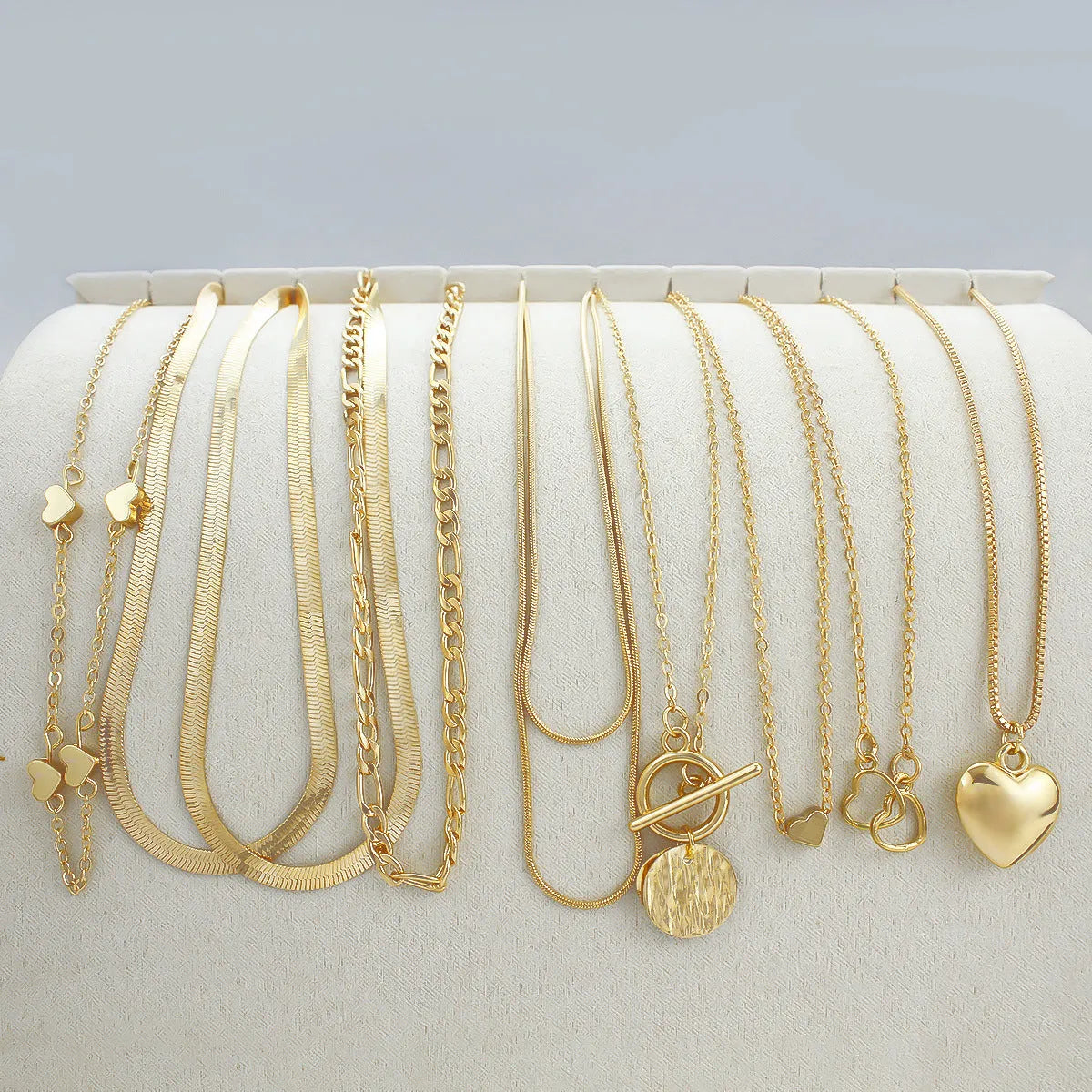 10-piece gold women's necklace set with adjustable snake bone chain and alloy pendants