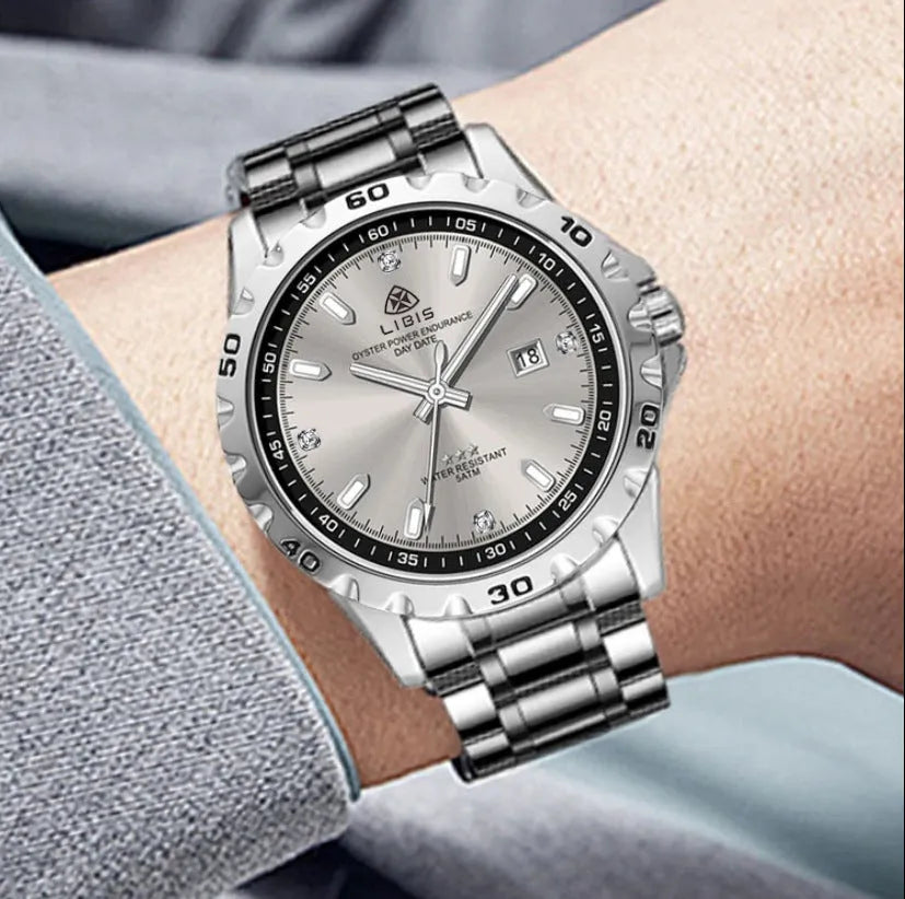 Men's silver stainless steel quartz watch with luminous hands on a black or grey dial
