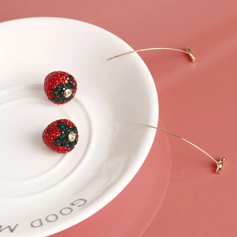 Red geometric strawberry-shaped stud earrings for women on a zinc alloy base.